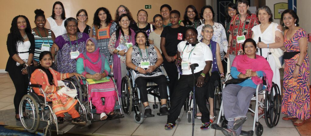 Group of women from around the world gather for a photo at AWID